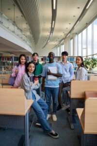 full-shot-smiley-students-library