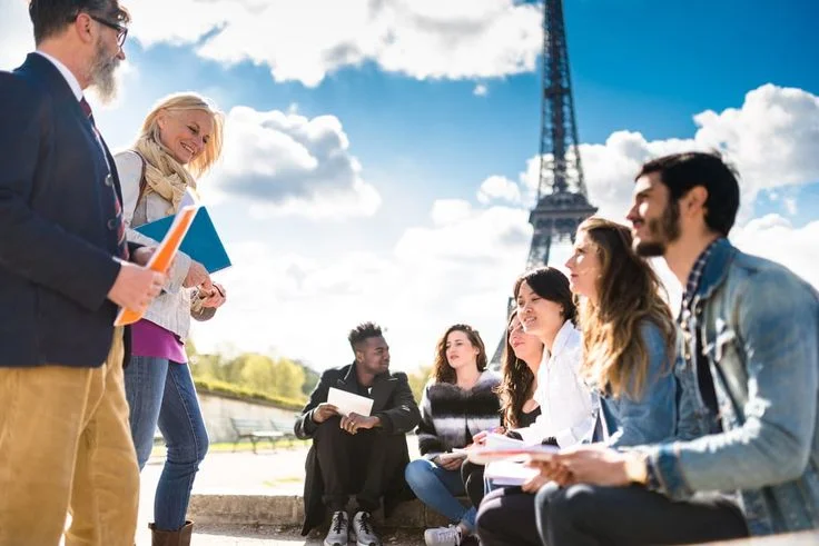 Students on a tourism study trip in Paris, Eiffel Tower in background